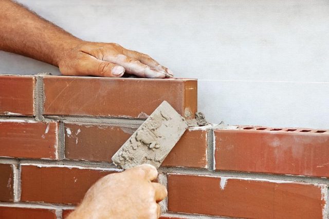 Masonry Contractor Erie, PA Masonry Contractor laying bricks